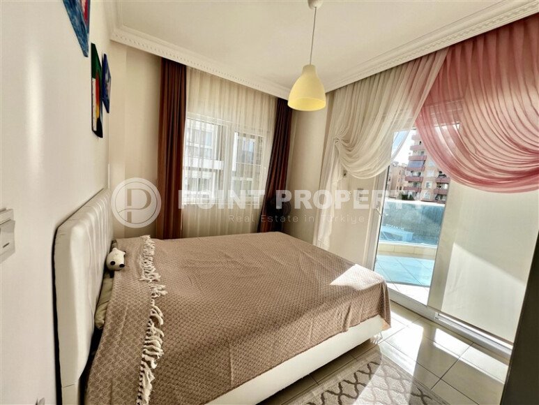 Spacious 2+1 apartment – 100 m2 with a beautiful view of the pool and surrounding area in Mahmutlar-id-10450-photo-5