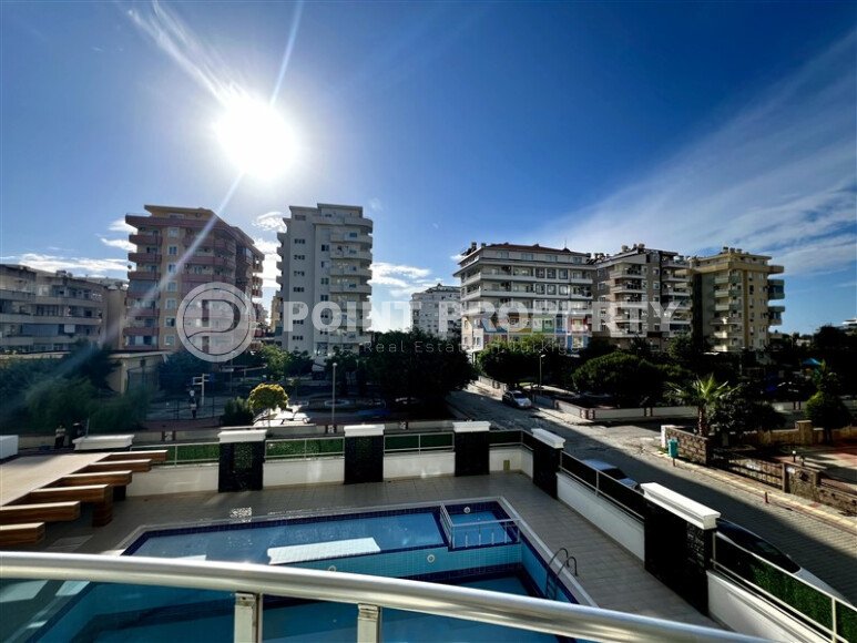 Spacious 2+1 apartment – 100 m2 with a beautiful view of the pool and surrounding area in Mahmutlar-id-10450-photo-7