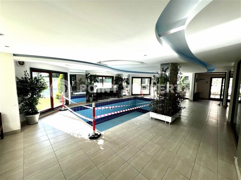 Spacious 2+1 apartment – 100 m2 with a beautiful view of the pool and surrounding area in Mahmutlar-id-10450-photo-9