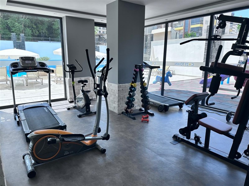 Элегантная квартира 52 м² в Махмутларе с застеклённым балконом и современным дизайном-id-10463-фото-4