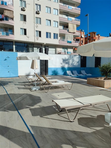 Элегантная квартира 52 м² в Махмутларе с застеклённым балконом и современным дизайном-id-10463-фото-18