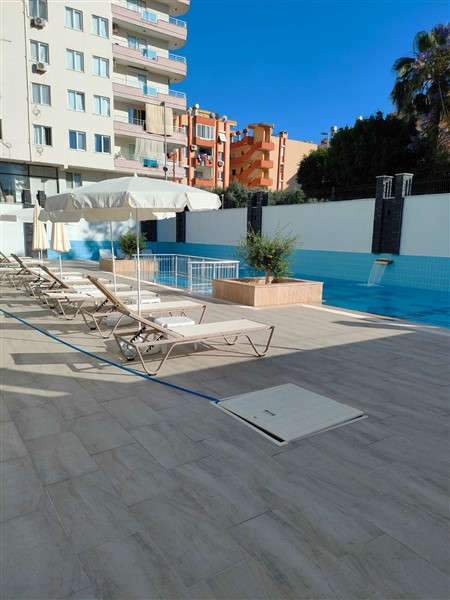 Элегантная квартира 52 м² в Махмутларе с застеклённым балконом и современным дизайном-id-10463-фото-20