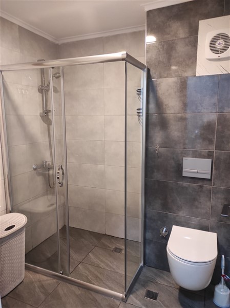 Элегантная квартира 52 м² в Махмутларе с застеклённым балконом и современным дизайном-id-10463-фото-21