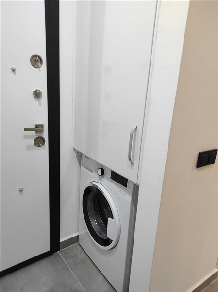 Элегантная квартира 52 м² в Махмутларе с застеклённым балконом и современным дизайном-id-10463-фото-22