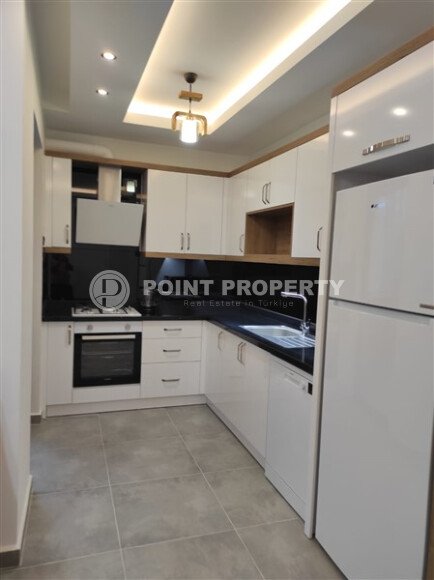 Элегантная квартира 52 м² в Махмутларе с застеклённым балконом и современным дизайном-id-10463-фото-27