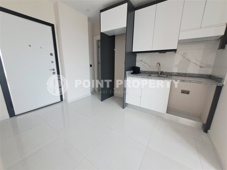 Новая 1+1, 44 м² в районе Авсаллар в крупном комплексе — дом 2024 года-id-10465-фото-1