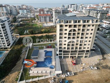 Элитные квартиры в комплексе с отличной локацией, центр района Махмутлар. До моря 700 метров.-id-1068-фото-4