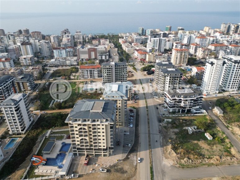 Элитные квартиры в комплексе с отличной локацией, центр района Махмутлар. До моря 700 метров.-id-1068-фото-5