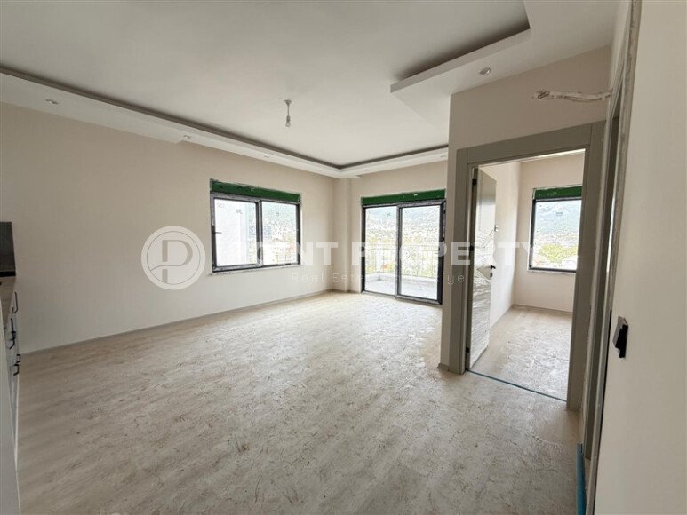 Современная 1+1 в районе Оба с видом на горы — новостройка 2025 года-id-10474-фото-1