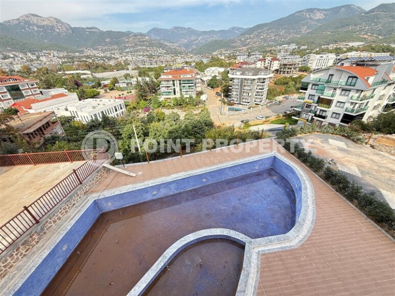 Современная 1+1 в районе Оба с видом на горы — новостройка 2025 года-id-10474-фото-8