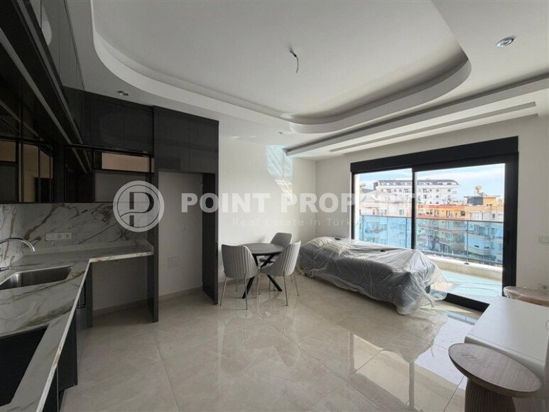 New apartment with fine finishing 800 meters from the sea, in the center of Alanya-id-7542-photo-2