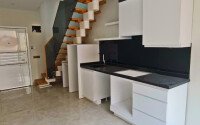 Двухуровневая квартира 55 м² на первой линии в Махмутларе-id-10484-фото-2