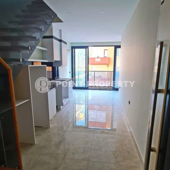 Двухуровневая квартира 55 м² на первой линии в Махмутларе-id-10484-фото-3