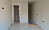 Двухуровневая квартира 55 м² на первой линии в Махмутларе-id-10484-фото-6