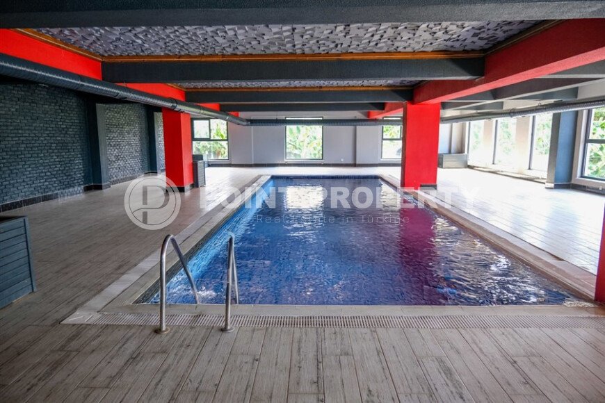 Elegant 90 m² apartment in Mahmutlar with a rooftop pool and atrium entrance-id-10534-photo-26