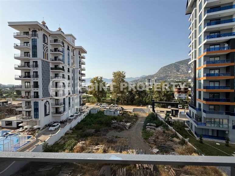 Современная квартира 55 м² в новом комплексе района Махмутлар-id-10536-фото-23