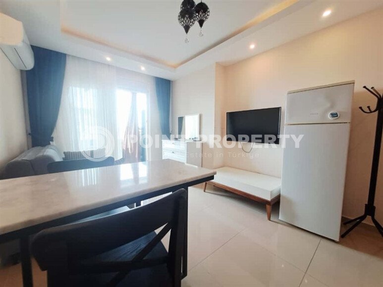 Уютная студия 30 м² с застеклённым балконом, район Махмутлар-id-10543-фото-3