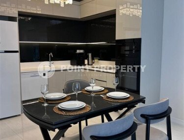 Стильная квартира 129 м² в комплексе с международным отелем, с возможностью краткосрочной аренды, район Тюрклер-id-10547-фото-2