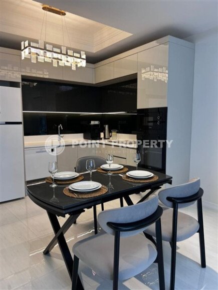 Стильная квартира 129 м² в комплексе с международным отелем, с возможностью краткосрочной аренды, район Тюрклер-id-10547-фото-2