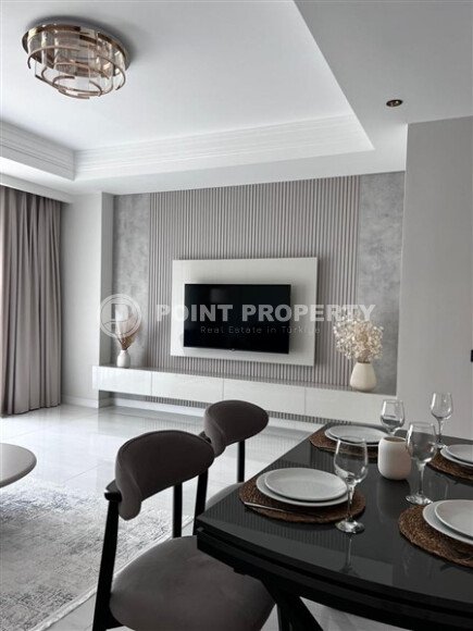 Стильная квартира 129 м² в комплексе с международным отелем, с возможностью краткосрочной аренды, район Тюрклер-id-10547-фото-3