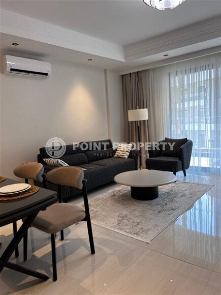 Стильная квартира 129 м² в комплексе с международным отелем, с возможностью краткосрочной аренды, район Тюрклер-id-10547-фото-4