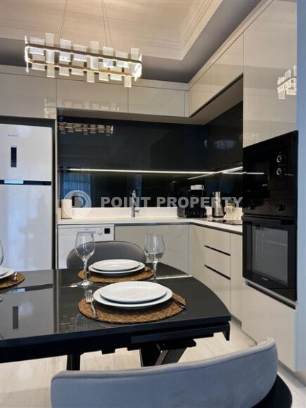 Стильная квартира 129 м² в комплексе с международным отелем, с возможностью краткосрочной аренды, район Тюрклер-id-10547-фото-9