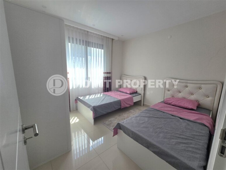 Светлая квартира 85 м² с частичным видом на море, район Каргыджак-id-10557-photo-1