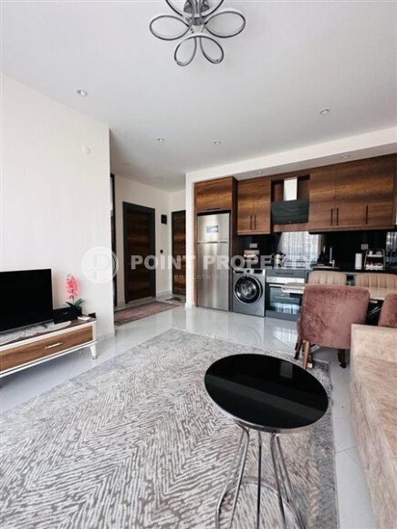 Уютная квартира 55 м² в жилом комплексе с инфраструктурой, район Махмутлар-id-10563-фото-1