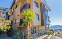 Garden duplex 204 m² with mountain view and partial sea view, Alanya center, Tepe-id-10570-photo-1