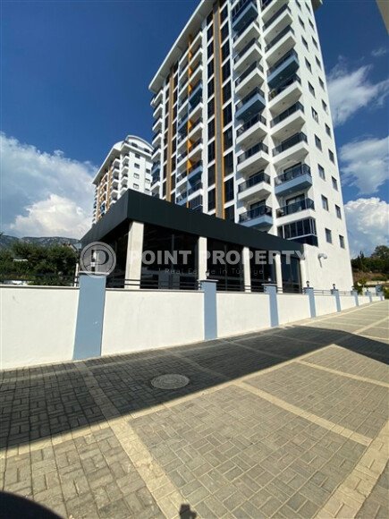 Светлая квартира 50 м² с панорамными окнами и видом на море, район Махмутлар-id-10581-photo-1