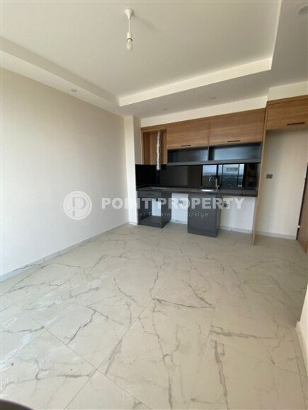 Светлая квартира 50 м² с панорамными окнами и видом на море, район Махмутлар-id-10581-photo-9