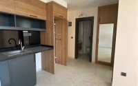 Светлая квартира 50 м² с панорамными окнами и видом на море, район Махмутлар-id-10581-photo-19
