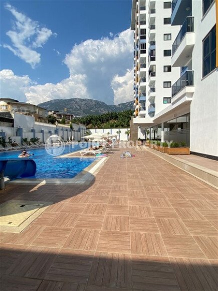 Светлая квартира 50 м² с панорамными окнами и видом на море, район Махмутлар-id-10581-photo-28