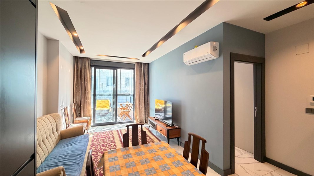 Современная квартира 50 м² с богатой инфраструктурой в центре района Махмутлар-id-10585-фото-4