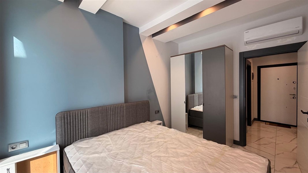 Современная квартира 50 м² с богатой инфраструктурой в центре района Махмутлар-id-10585-фото-7