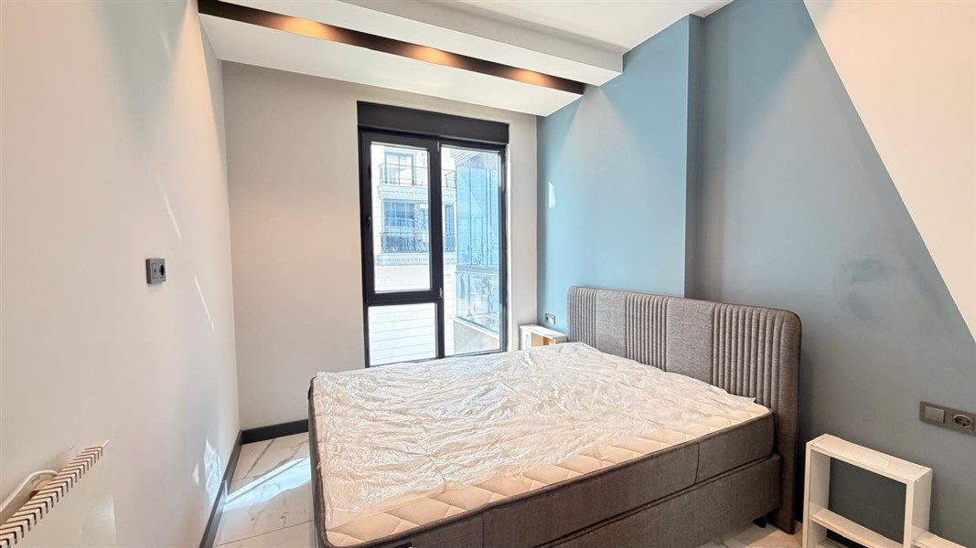 Современная квартира 50 м² с богатой инфраструктурой в центре района Махмутлар-id-10585-фото-8