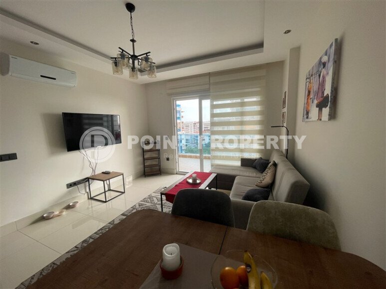 Комфортабельная квартира, 60 м², район Тосмур, с крытой парковкой, частичный вид на море-id-10594-фото-3