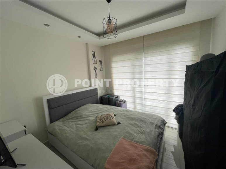 Комфортабельная квартира, 60 м², район Тосмур, с крытой парковкой, частичный вид на море-id-10594-фото-5