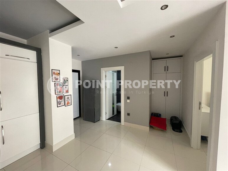 Комфортабельная квартира, 60 м², район Тосмур, с крытой парковкой, частичный вид на море-id-10594-фото-11