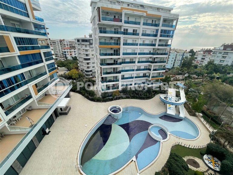 Комфортабельная квартира, 60 м², район Тосмур, с крытой парковкой, частичный вид на море-id-10594-фото-12