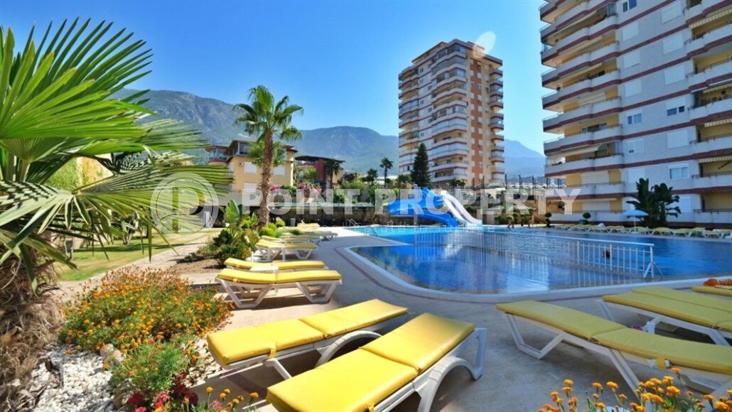 Spacious 130 m² apartment in Mahmutlar, with a separate kitchen and sea view.-id-10610-photo-1