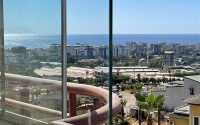 Spacious 130 m² apartment in Mahmutlar, with a separate kitchen and sea view.-id-10610-photo-21
