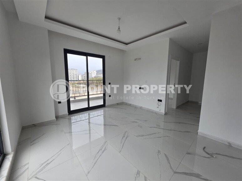 Солнечная квартира на центральной улице, 52 м², район Махмутлар-id-10612-фото-2