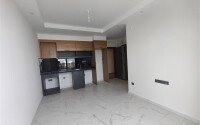 Доступная 50 м² с видом на море и трансфером, район Махмутлар-id-10628-photo-7