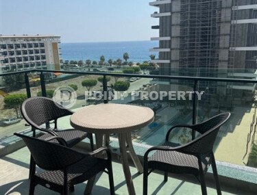 Spacious 63 m² apartment on the first line with sea views and its own underground passage to the beach, Mahmutlar district-id-10641-photo-1