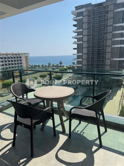 Spacious 63 m² apartment on the first line with sea views and its own underground passage to the beach, Mahmutlar district-id-10641-photo-1