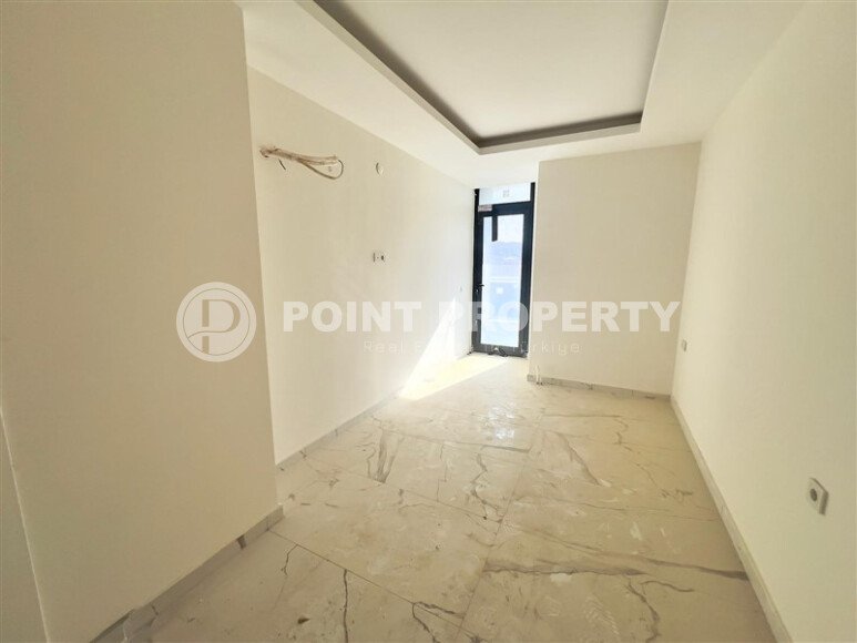 Солнечная квартира 1+1 – 55 м² в комплексе с богатой инфраструктурой, Махмутлар-id-10701-фото-3