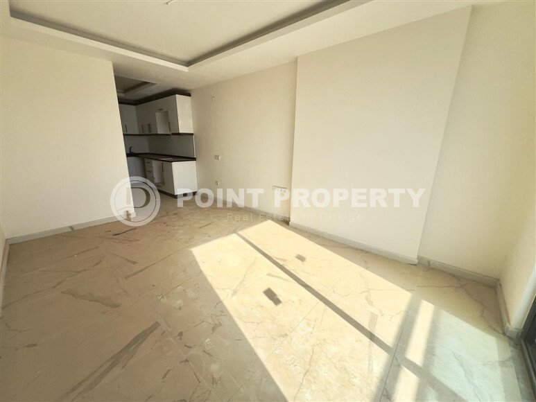 Солнечная квартира 1+1 – 55 м² в комплексе с богатой инфраструктурой, Махмутлар-id-10701-фото-6