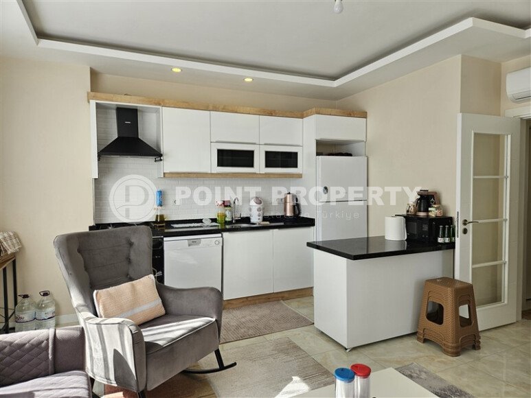 Солнечные апартаменты 55 м² с панорамными окнами и уютным угловым балконом в районе Тосмур-id-10777-фото-2