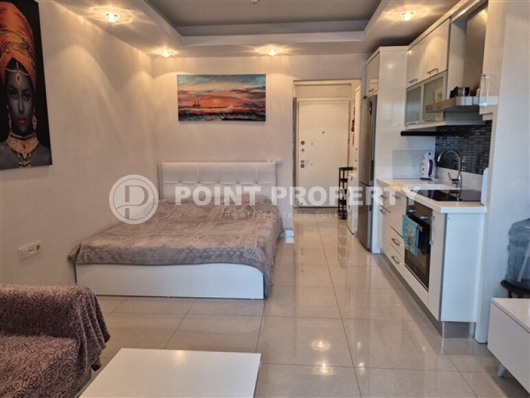 Уютная студия 0+1 в районе Махмутлар с застекленным балконом и видом на горы-id-10781-фото-5